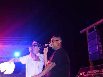 Two performers on stage under purple lights – LIFT Beach Club, Zrće Beach