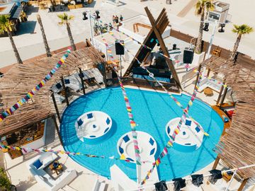 Aerial view of the round pool, cabanas and dancefloor – Nomad Beach Club, Zrce Beach