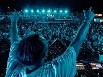 DJ with arms raised above the crowd – Symbol Beach Club, Zrce Beach
