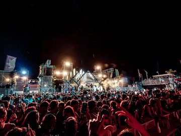 Night crowd in front of the lit stage – Symbol Beach Club, Zrce Beach