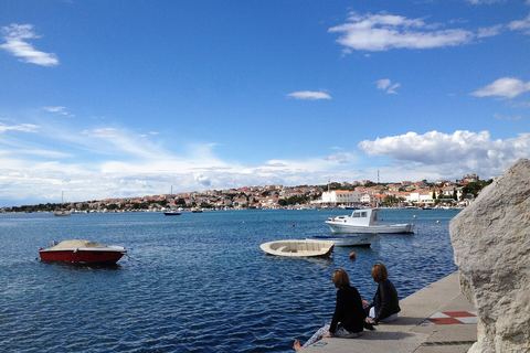 Small boats in Novalja bay by the promenade